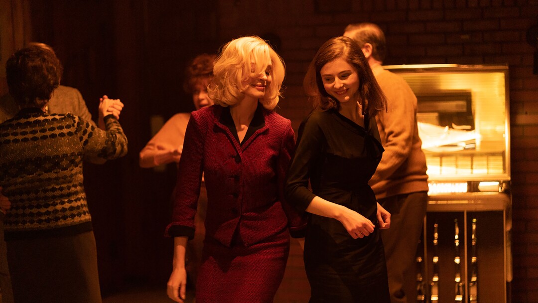 (Sundance Institute) Anne Hathaway, left, and Thomasin McKenzie play coworkers in a Massachusetts prison, circa 1964, in director William Oldroyd's "Eileen," an official selection of the Premieres program at the 2023 Sundance Film Festival.
