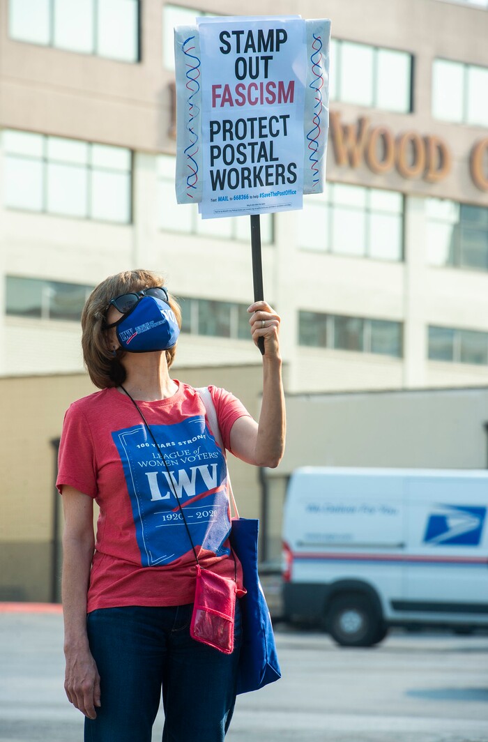 (Rick Egan  |  The Salt Lake Tribune)   Helen Moser joins protesters during a rally to "Save the Post Office," hosted by Alliance for a Better Utah, NAACP Salt Lake Branch, League of Women Voters at the Post Office on 200 South in Salt Lake City, Saturday, Aug. 22, 2020.