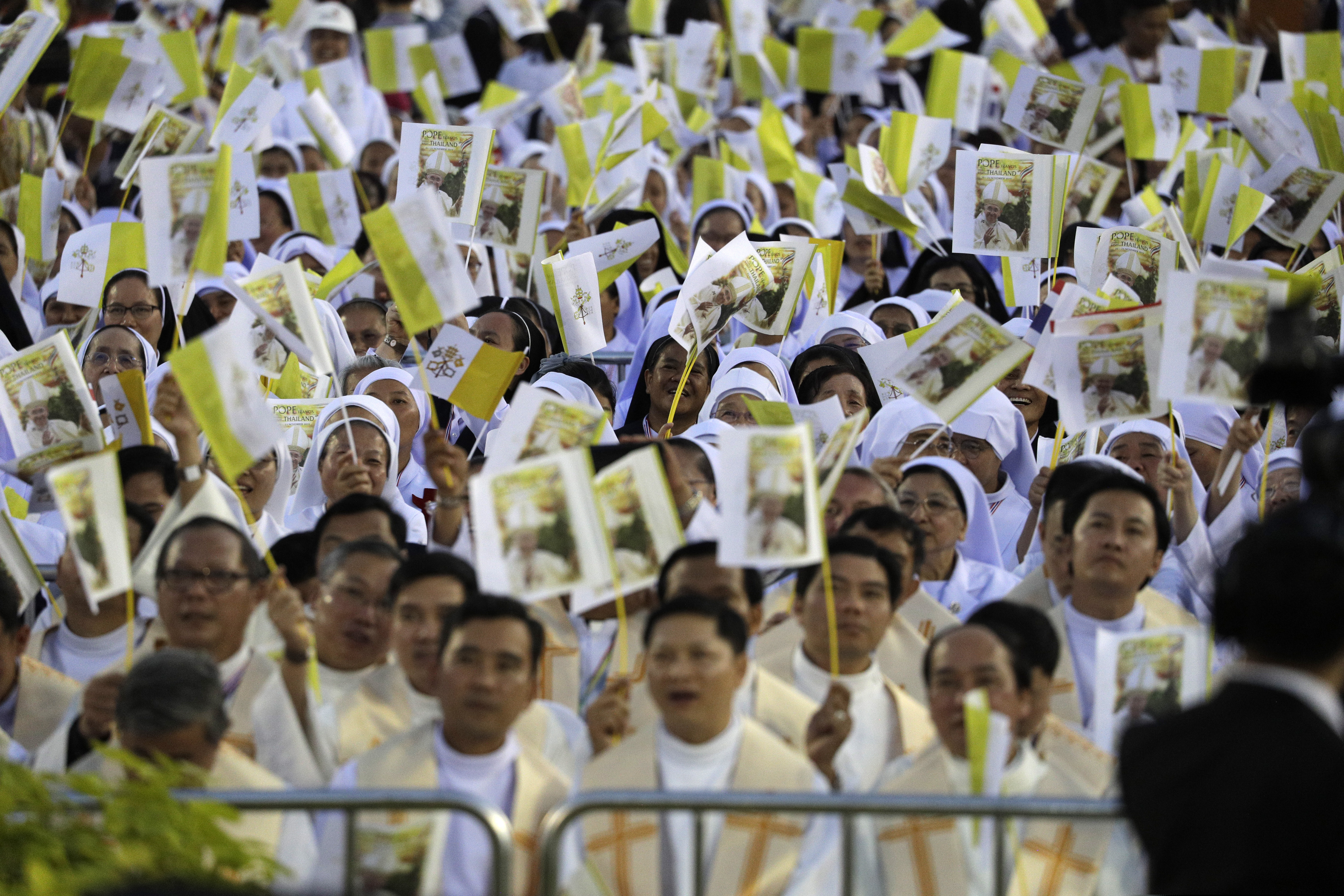 (Gregorio Borgia | The Associated Press) Clergy and the faithful attend a Mass celebrated by Pope Francis at the National Stadium, Thursday, Nov. 21, 2019, in Bangkok, Thailand.