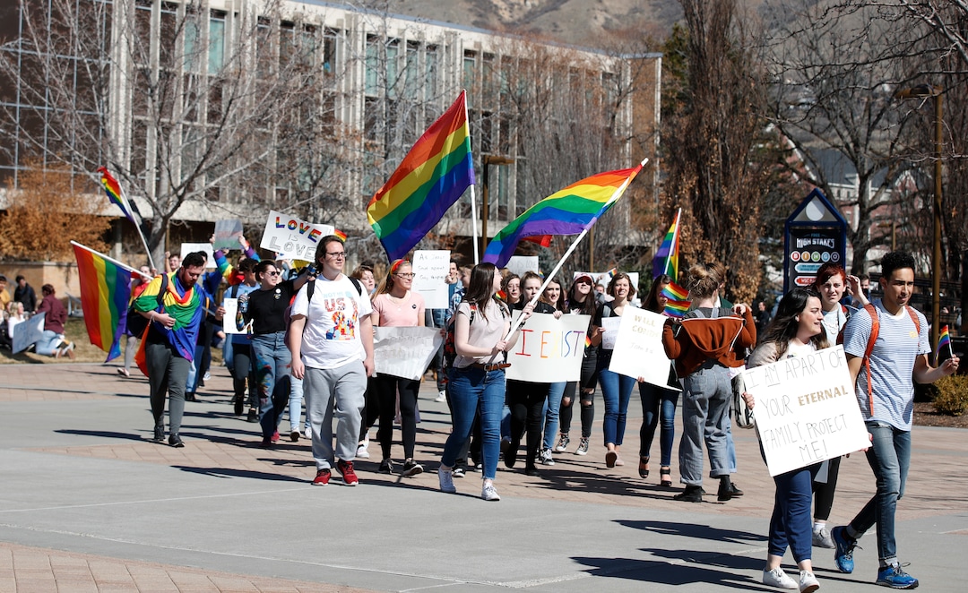 (George Frey  |  special to The Salt Lake Tribune) BYU students and others gather in front of the Ernest L. Wilkinson Student Center on the campus of Brigham Young University to protest BYUÕs rollback of a newly announced policy change on LGBTQ students on March 5, 2020 in Provo, Utah.
