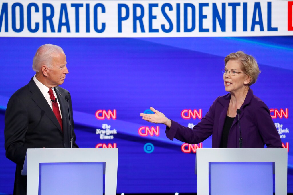 (John Minchillo | AP) Democratic presidential candidate former Vice President Joe Biden and Sen. Elizabeth Warren, D-Mass., participate in a Democratic presidential primary debate hosted by CNN/New York Times at Otterbein University, Tuesday, Oct. 15, 2019, in Westerville, Ohio.