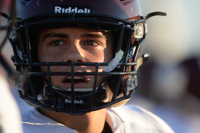 (Francisco Kjolseth  |  The Salt Lake Tribune)  Jordan quarterback Crew Wakley joins his team on the sidelines during a game against Syracuse on Thursday, Aug. 24, 2017.