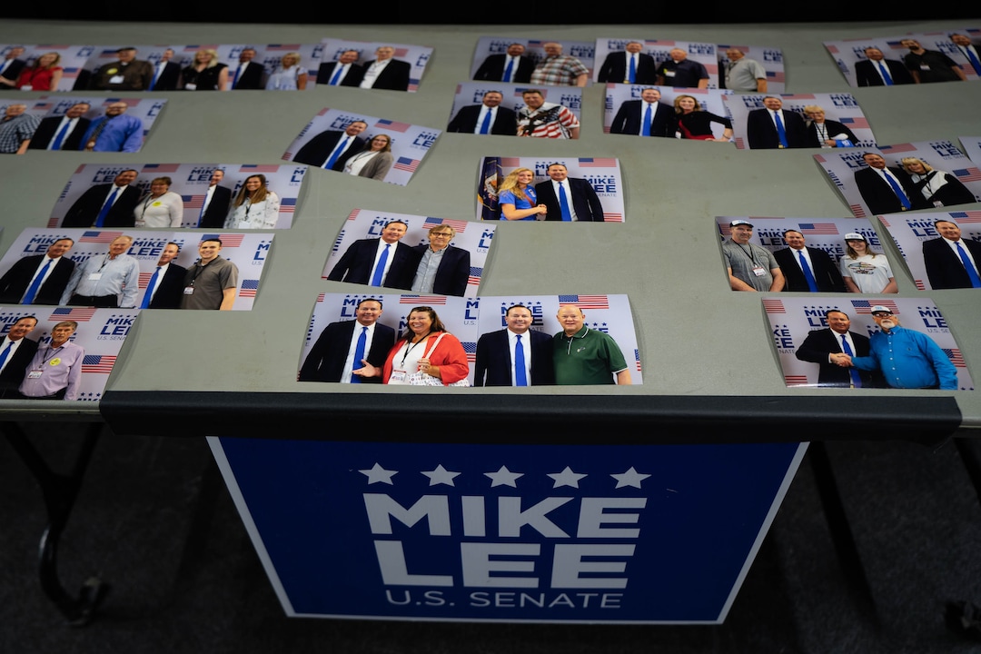 (Francisco Kjolseth | The Salt Lake Tribune) Photographs taken with Sen. Mike Lee sit on a table waiting to get picked up by delegates following the Utah Republican Party’s 2021 Organizing Convention at the Maverik Center in West Valley City on Saturday, May 1, 2021, held in-person after the pandemic forced the nominating convention to go online last year.