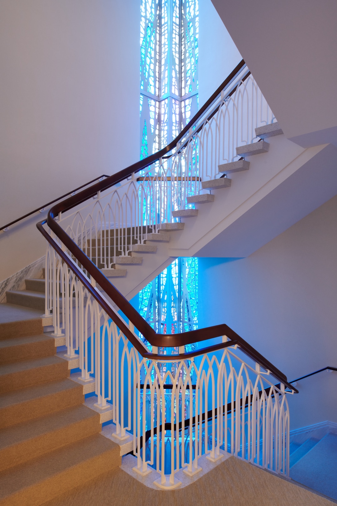 (The Church of Jesus Christ of Latter-day Saints) Stained glass windows adorn a staircase in the newly renovated Washington D.C. Temple. The glass motifs were disassembled by hand, cleaned and placed back together, according to the church.