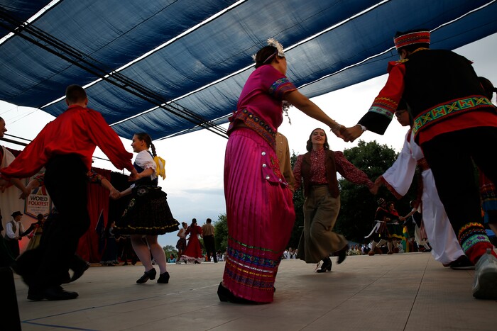 (Daniel Carde | for The Salt Lake Tribune) Performers from seven countries dance together to a compliation songs from the musical ÒOklahomaÓ at the World Folkfest at the Springville Arts Park, Springville, Thursday, Aug. 1, 2018.