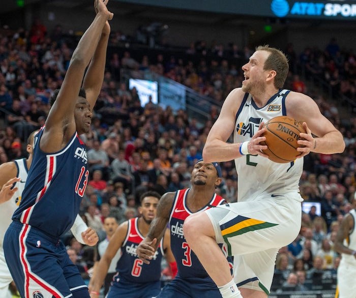(Rick Egan  |  The Salt Lake Tribune)   Utah Jazz guard Joe Ingles (2), takes the ball to the basket, as Washington Wizards center Thomas Bryant (13) defends, in NBA action between the Utah Jazz and the Washington Wizards, in Salt Lake City, Friday, February 28, 2020