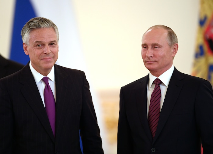 3204871 10/03/2017 October 3, 2017. Russian President Vladimir Putin and Ambassador Extraordinary and Plenipotentiary of the United States to Russia Jon Meade Huntsman, left, at the ceremony to present credentials of foreign ambassadors. The Grand Kremlin Palace's Alexander Hall. Evgeny Biyatov/Sputnik  via AP