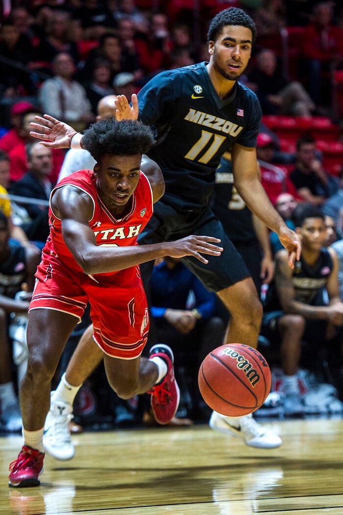 (Chris Detrick  |  The Salt Lake Tribune)  Utah Utes guard Kolbe Caldwell (2) runs past Missouri Tigers forward Jontay Porter (11) during the game at the Jon M. Huntsman Center Thursday, November 16, 2017.   