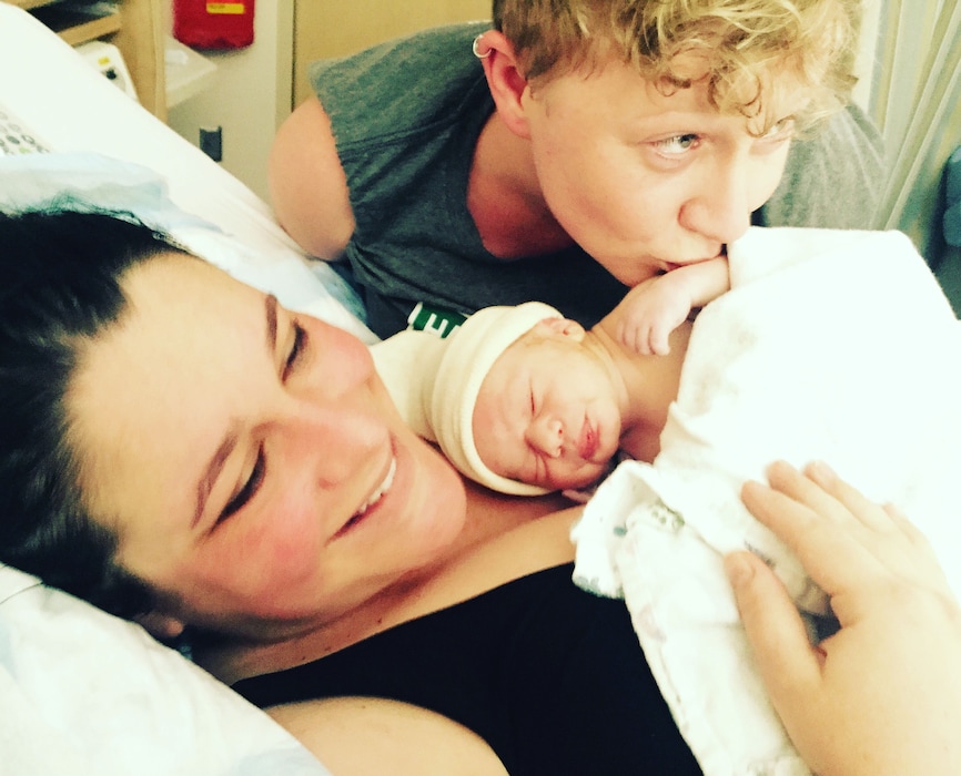 (Courtesy of Natalie Royster-Jensen) Taken by their amazing doula, this is the first family photo of Marina, Elenor and Harvey Gomberg moments after his birth.