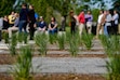 (Francisco Kjolseth | The Salt Lake Tribune) People attend the ribbon cutting of the new 6,315 square foot Wheeler Historic Farm Outdoor Education Center on Wednesday, May 11, 2022. Exterior landscaping, once established, will operate as a demonstration and teaching garden.