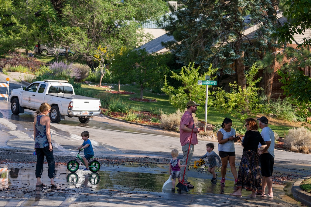 (Leah Hogsten | The Salt Lake Tribune) The atmosphere along Teton Drive in Millcreek was a communal as neighbors, all without water after two main water breaks in their neighborhood, determined their neighbor's needs. The two water main breaks happened prior to a wildfire in their neighborhood. Unified Fire Authority called on 40 firefighters and two single engine air tankers to combat a wildfire near 3600 E and 3000 S in Millcreek that threatened several homes, Aug. 5, 2021.