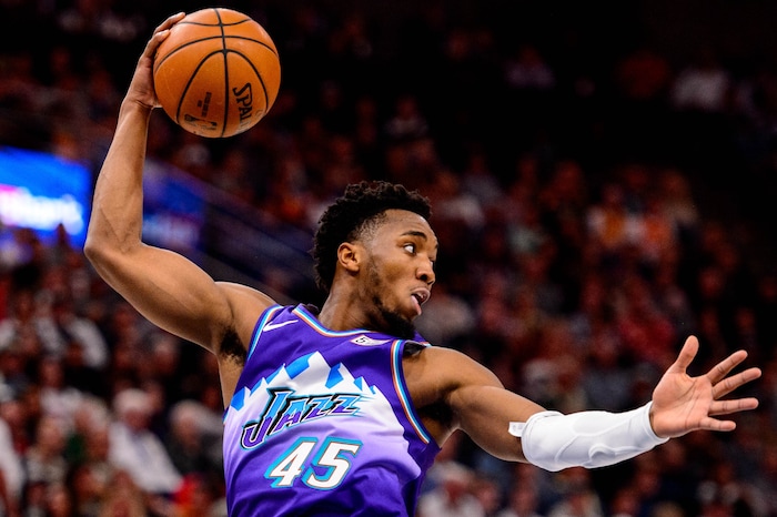 (Trent Nelson  |  The Salt Lake Tribune) Utah Jazz guard Donovan Mitchell (45) rebounds as the Utah Jazz host the Portland Trail Blazers, NBA basketball in Salt Lake City on Thursday, Dec. 26, 2019.