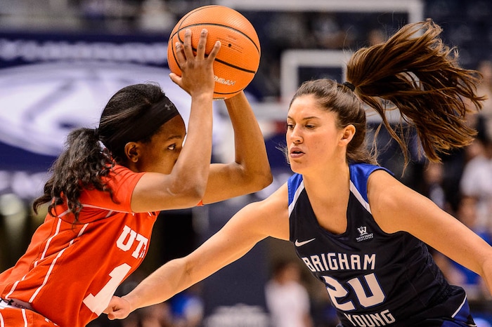 (Trent Nelson | The Salt Lake Tribune)  Utah Utes guard Erika Bean (11) defended by Brigham Young Cougars guard Cassie Broadhead Devashraye (20) as BYU hosts Utah, NCAA women's basketball in Provo, Saturday December 9, 2017.