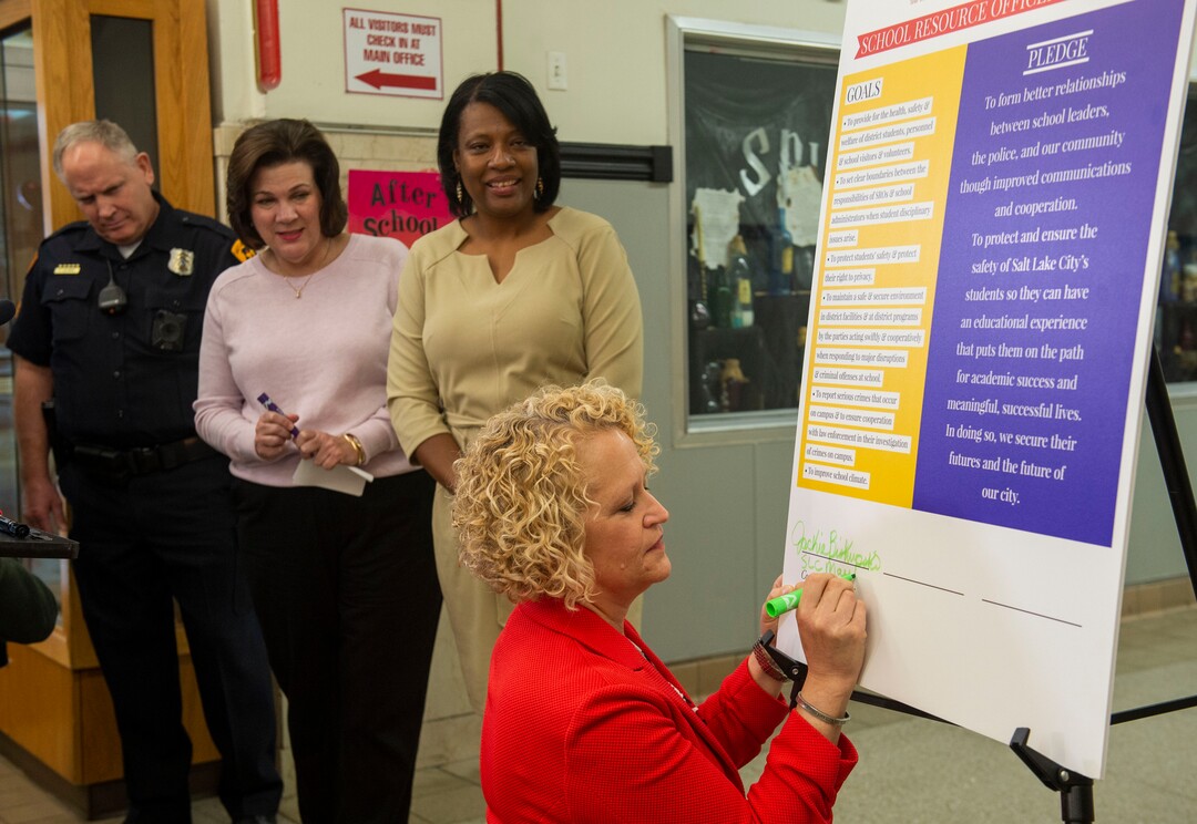 (Rick Egan  |  The Salt Lake Tribune)       Salt Lake City Mayor Jackie Biskupski  signs the school resource officer contract at West High School, Tuesday, March 26, 2019.