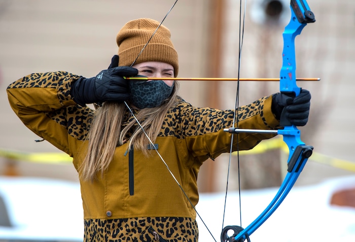 (Rick Egan | The Salt Lake Tribune) Carly Kelson practices on the archery range for tomorrow's competition, during the 36th annual Ruby's Inn Bryce Canyon Winter Festival on 
Saturday, Feb. 13, 2021.