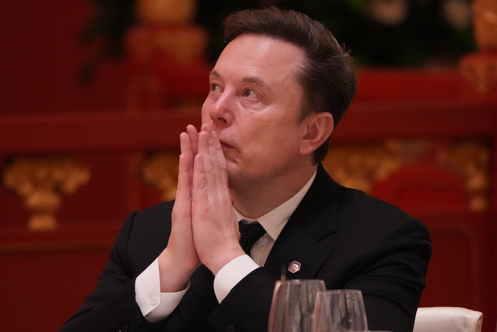 Elon Musk listens to the speech of Chinese President Xi Jinping during a state dinner with President Donald Trump at the Great Hall of the People on Thursday May 14, 2026, in Beijing. (AP Photo/Mark Schiefelbein)