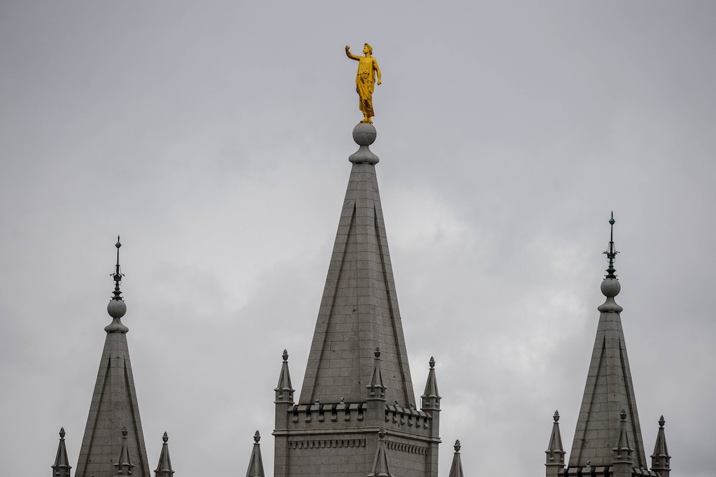 (Trent Nelson  |  The Salt Lake Tribune) The statue of Moroni, missing its horn, atop the Salt Lake Temple, damaged in an earthquake in Salt Lake City on Wednesday, March 18, 2020.