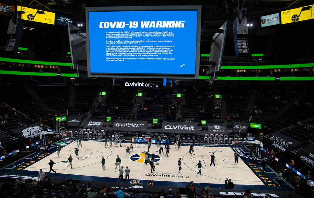 (Francisco Kjolseth  | The Salt Lake Tribune) COVID-19 warnings are display on the screen before the start of the Utah Jazz game against the Milwaukee Bucks at Vivint Smart Home Arena in Salt Lake City, on Friday, Feb. 12, 2021.