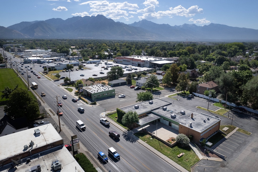 (Francisco Kjolseth | The Salt Lake Tribune) Millcreek is poised to host a winter overflow homeless shelter as the former Calvin S. Smith Library, 810 E. 3300 South, below right, is prepared on Wednesday, Aug. 31, 2022, to keep unsheltered Utahns out of the cold.
