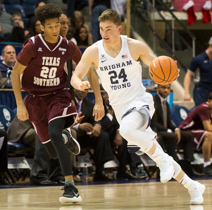 (Rick Egan  |  The Salt Lake Tribune)   Brigham Young Cougars guard McKay Cannon (24) leads a fast break, as Texas Southern Tigers forward Justin Hopkins (24) defends, in basketball action, Brigham Young Cougars vs Texas Southern Tigers, at the Marriott Center in Provo, Saturday, December 23, 2017.