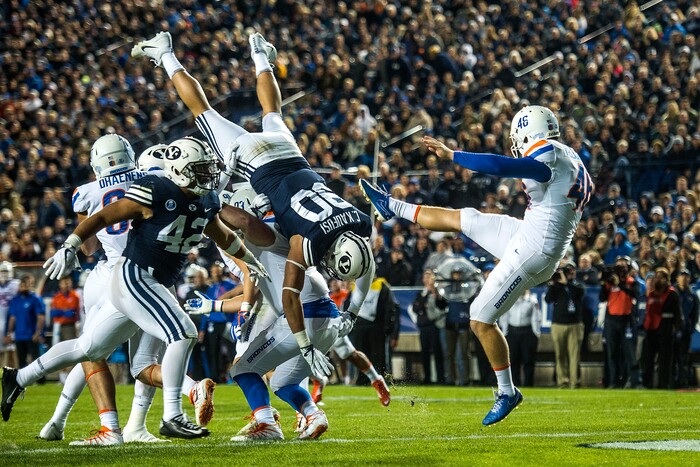 (Chris Detrick  |  The Salt Lake Tribune)  Brigham Young Cougars defensive lineman Corbin Kaufusi (90) attempts to block a punt by Boise State Broncos place kicker Joel Velazquez (46) during the game LaVell Edwards Stadium Friday, October 6, 2017. 