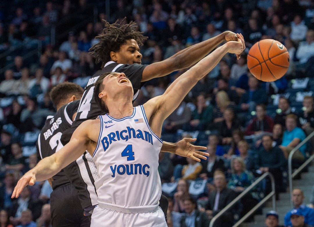 (Rick Egan  |  The Salt Lake Tribune)       Nevada Wolf Pack guard Lindsey Drew (14) blocks a shot by Brigham Young Cougars guard Alex Barcello (4), in basketball action between the Brigham Young Cougars and the Nevada Wolf Pack, at the Marriott Center, in Provo, Saturday, December 10, 2019.