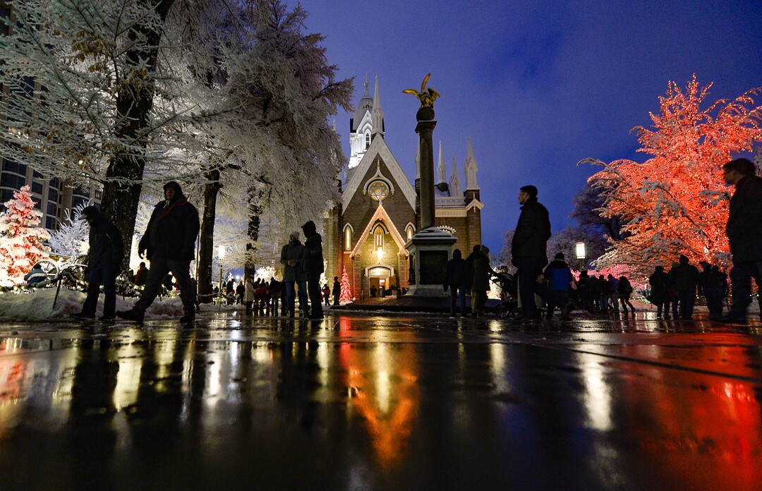 (Francisco Kjolseth  |  The Salt Lake Tribune)  Visitors take in the sights as Temple Square in Salt Lake City comes to life Friday, November 29, 2019, as hundreds of thousands of colorful LED bulbs light up, a yearly tradition that started in 1965. The lights will run through the end of the year.