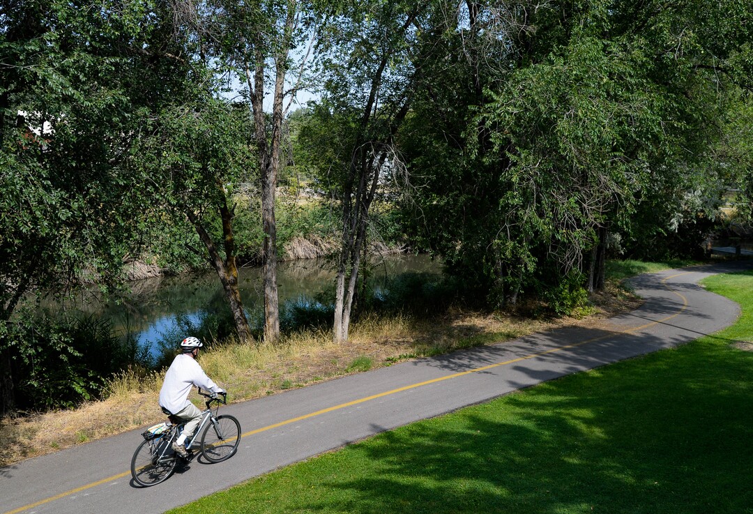 (Francisco Kjolseth  |  The Salt Lake Tribune) People recreate near the International Peace Gardens along the Jordan River Parkway on Wednesday, August 5, 2020, as new grant money becomes available to refresh the comprehensive master plan for the 51-mile parkway stretching from Utah Lake in Utah County to the wetlands of the Great Salt Lake.