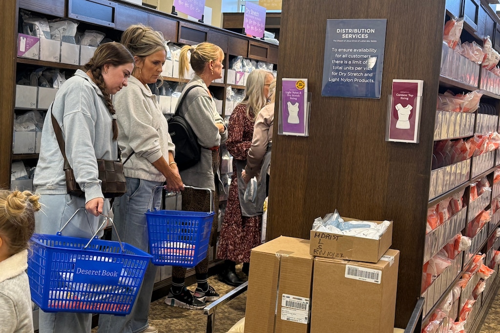 (Hannah Schoenbaum | AP) Members of The Church of Jesus Christ of Latter-day Saints shop for new sleeveless garments at Deseret Book in Salt Lake City in October 2025.