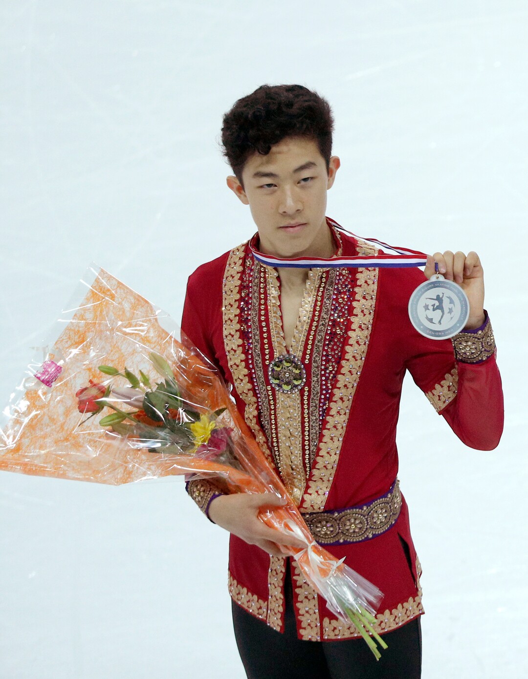 Nathan Chen of the U.S poses with the silver medal after the Men Skating Program during ISU Grand Prix of Figure Skating Final in Marseille, southern France, Saturday, Dec. 10, 2016. (AP Photo/Christophe Ena)