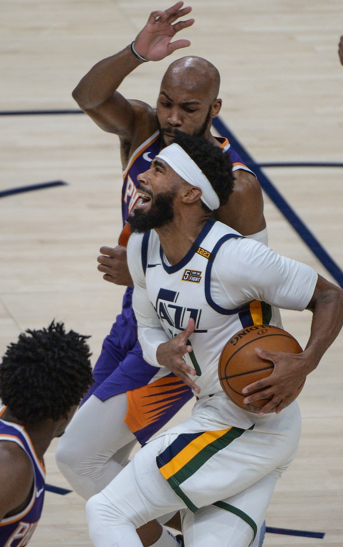 (Leah Hogsten | The Salt Lake Tribune) Utah Jazz guard Mike Conley (10) drives through Phoenix Suns defense as the Jazz crack open their 2020-21 preseason with their second game against the Phoenix Suns, Dec. 14, 2020.