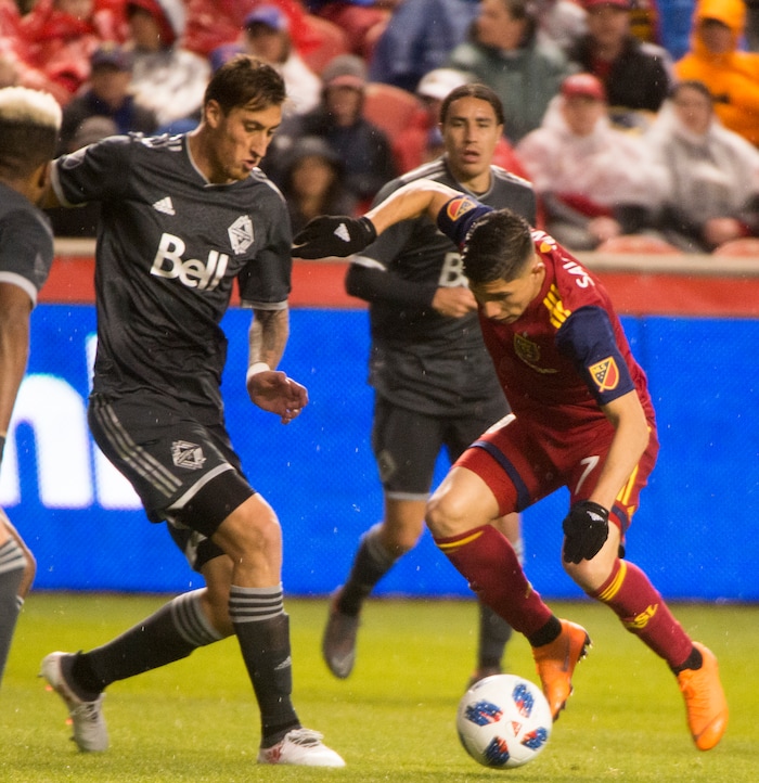 (Rick Egan  |  The Salt Lake Tribune)      Vancouver Whitecaps defender Jose Aja (18)) goes for the ball along with 
Real Salt Lake forward Jefferson Savarino (7), in MLS action between Real Salt Lake and Vancouver Whitecaps, at Rio Tinto Stadium beSaturday, April 7, 2018.



