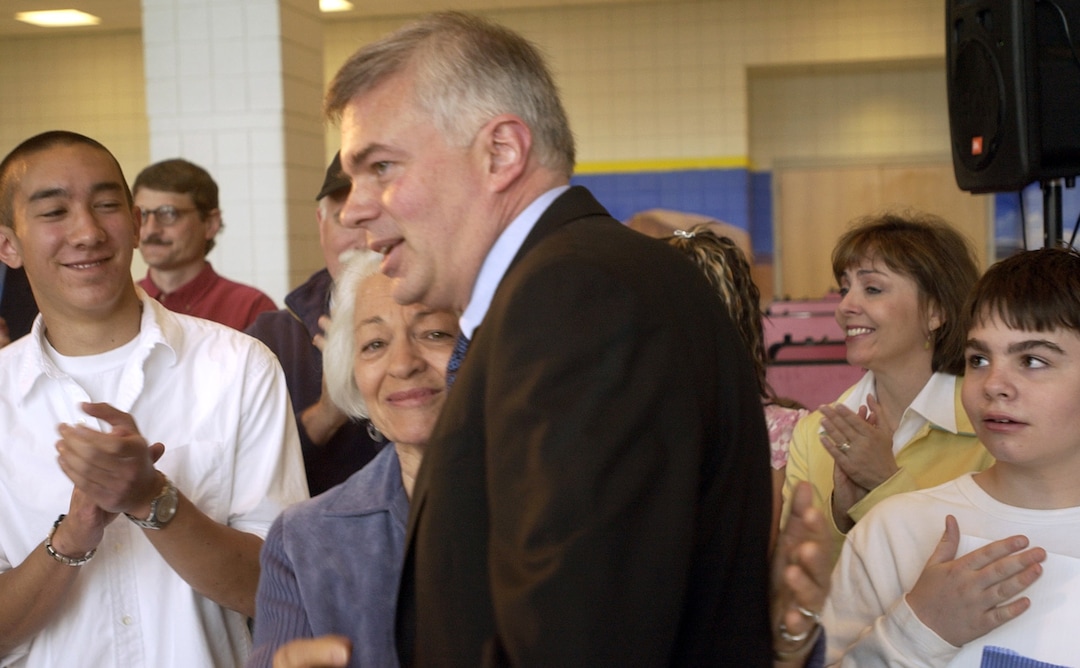 (Al Hartmann  |  Tribune file photo) Norma Matheson hugs her son Scott Matheson, Jr., after he announced his candidacy for governor during an event at East High in 2004. 