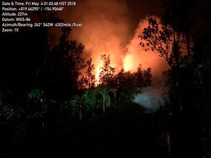 This Friday, May 4, 2018 remote image released by U.S. Geological Survey, shows a new lava fissure on Kilauea Volcano's lower East Rift Zone on Makamae and Leilani Streets in the Leilani Estates subdivision near Pahoa, Hawaii. Spatter was being thrown roughly 100 ffeet high at the time of this image. The Kilauea volcano sent more lava into Hawaii communities Friday, a day after forcing more than 1,500 people to flee from their mountainside homes, and authorities detected high levels of sulfur gas that could threaten the elderly and people with breathing problems. (U.S. Geological Survey via AP) (U.S. Geological Survey via AP)