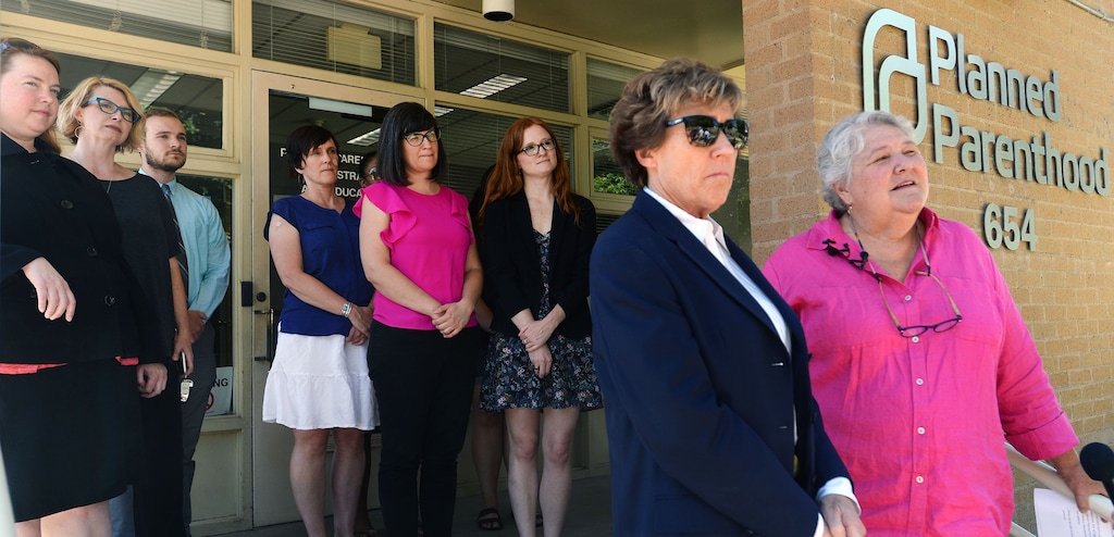 (Steve Griffin | Tribune file photo) Karrie Galloway, CEO and president of Planned Parenthood Association of Utah, is joined by attorney Peggy Tomsic and others as they talk to the media outside the Planned Parenthood office in Salt Lake City on Tuesday, July 12, 2016.
