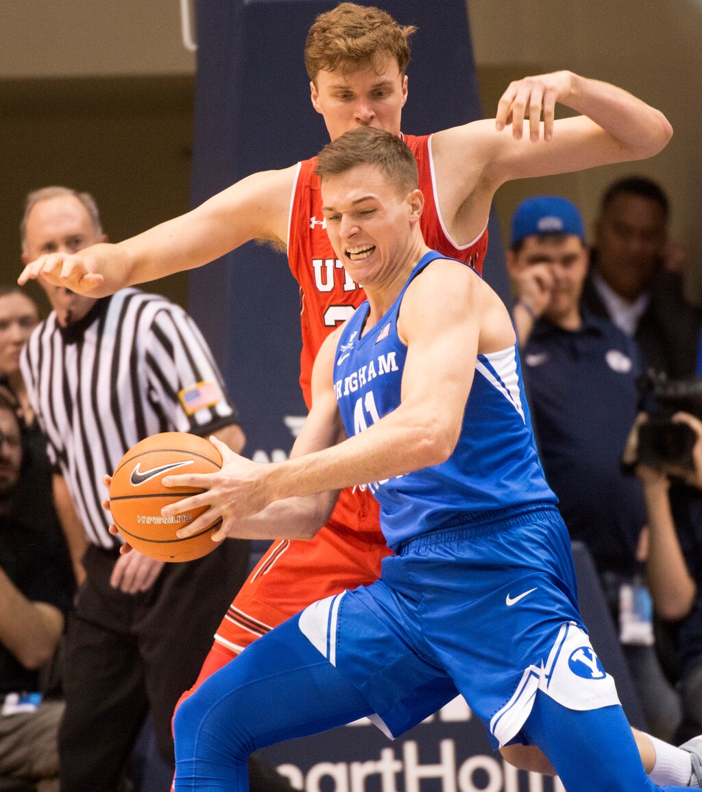 (Rick Egan  |  The Salt Lake Tribune)  Utah Utes center Jayce Johnson (34) guards Brigham Young forward Luke Worthington (41) in basketball action Utah Utes vs. Brigham Young Cougars at the Marriott Center in Provo, Saturday, December 15, 2017.