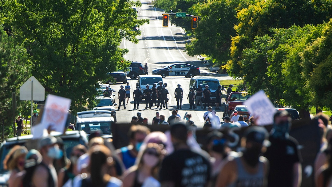 (Rick Egan  |  The Salt Lake Tribune)     Protesters turn around and march back up the hill, after they were halted by a police barricade on Logan Way, as they dance in the streets,  during a march for Justice on Sunday, July 12, 2020.