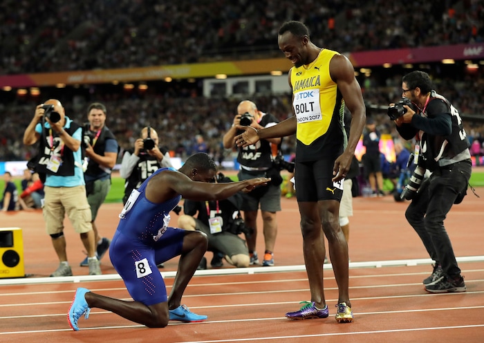 United States' Justin Gatlin bows to Jamaica's Usain Bolt after winning the Men's 100 meters final during the World Athletics Championships in London Saturday, Aug. 5, 2017. (AP Photo/Tim Ireland)