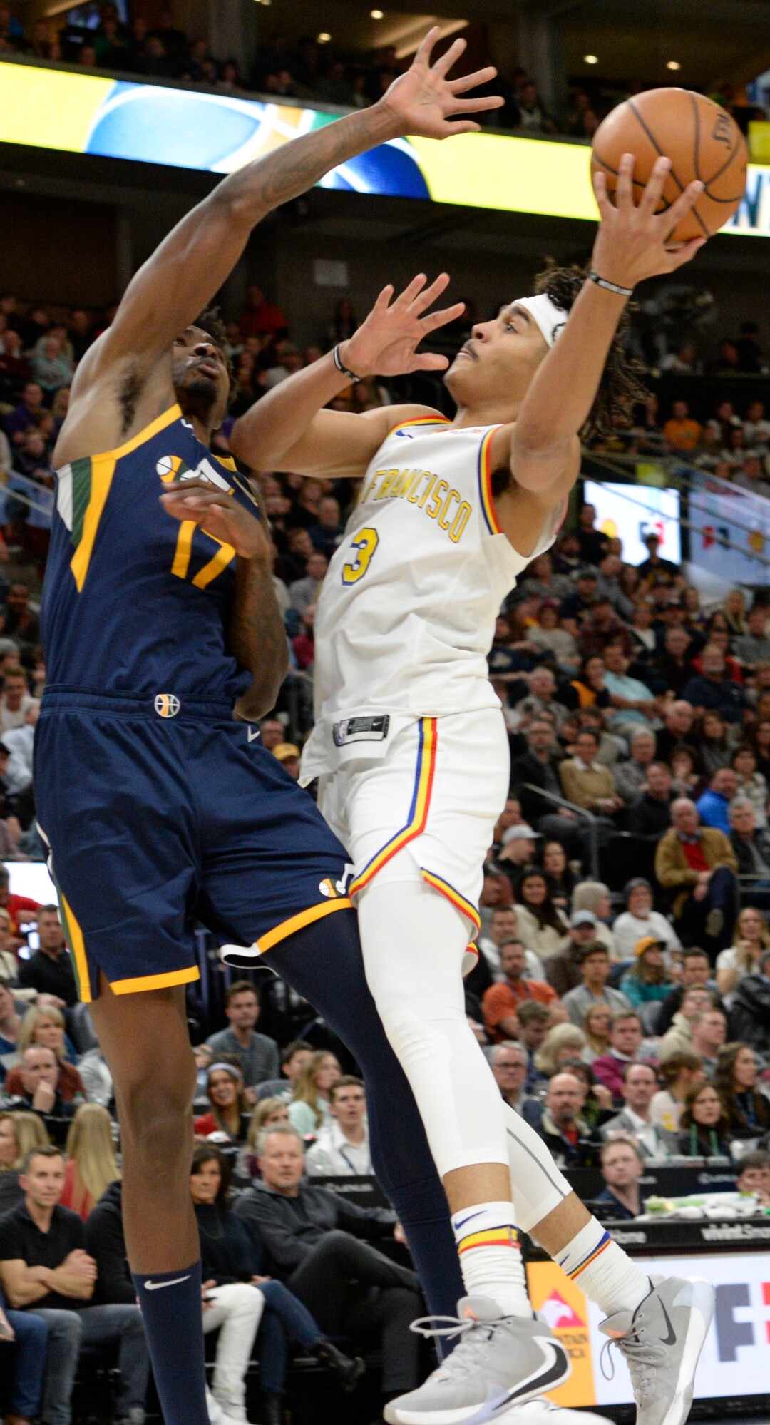 (Leah Hogsten  |  The Salt Lake Tribune) Utah Jazz center Ed Davis (17) blocks Golden State Warriors guard Jordan Poole (3)as the Utah Jazz defeated the Golden State Warriors, 114-106, Dec. 13, 2019 at Vivint Arena.