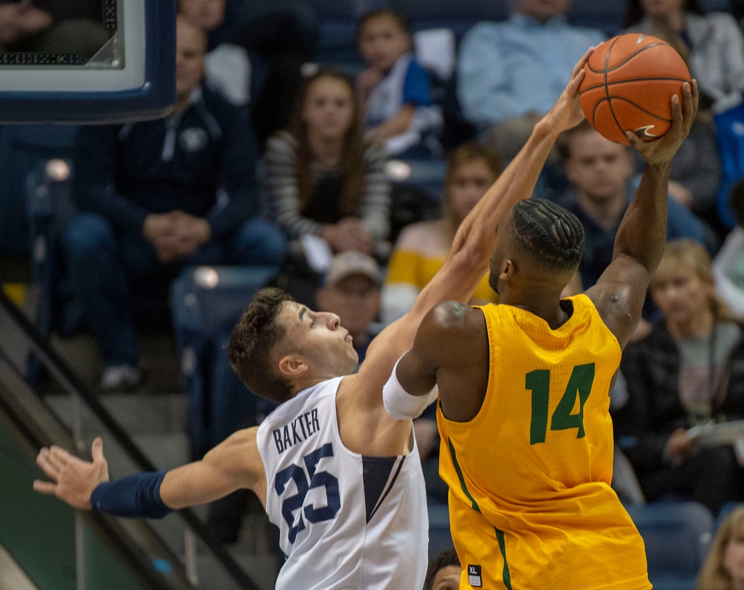 (Rick Egan  |  The Salt Lake Tribune)  Brigham Young Cougars forward Gavin Baxter (25) blocks a shot by San Francisco Dons guard Charles Minlend (14), in WCC basketball action at the Marriott Center, Thursday, February 21, 2018.