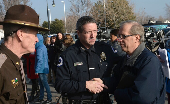 (Al Hartmann | The Salt Lake Tribune)
Utah Highway Patrol Col. Michael Rapich, left, and South Jordan Police Chief Jeff Carr thank Mike McMillian for sharing his family's story of loss when a drunk driver who was driving the wrong direction on I-215 killed their adult son "Mikey" in 2015. South Jordan Police and the Utah Highway Patrol said that there will be increased patrols and enforcement over the holiday to catch drunk drivers.