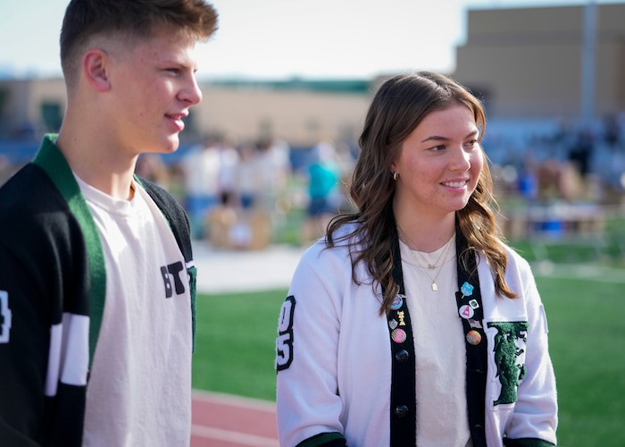 (Bethany Baker | The Salt Lake Tribune) Payson senior Ryland Baker, left, and Payson junior Sophie Savage give an interview before a charity event to commemorate the 40th anniversary of the movie "Footloose" on the football field of Payson High School in Payson on Saturday, April 20, 2024.