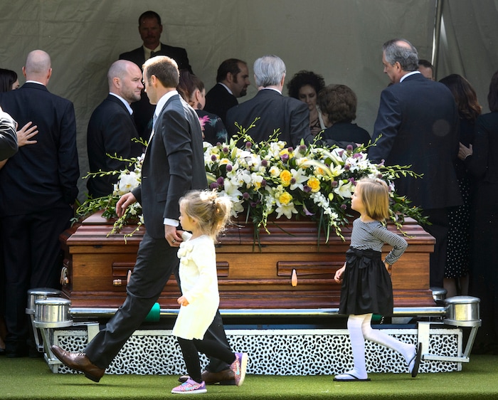 (Steve Griffin  |  The Salt Lake Tribune)  People gather around the casket following graveside services for Elder Robert D Hales at the Bountiful City Cemetery in Bountiful Friday October 6, 2017.
