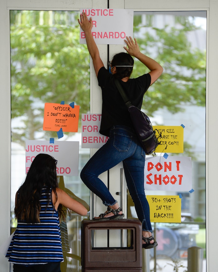 (Francisco Kjolseth  |  The Salt Lake Tribune) Demonstrators gather at the Salt Lake County District Attorney's office as they plaster the building asking for Justice for Bernardo Palacios Rally, on Thursday, June 18, 2020.