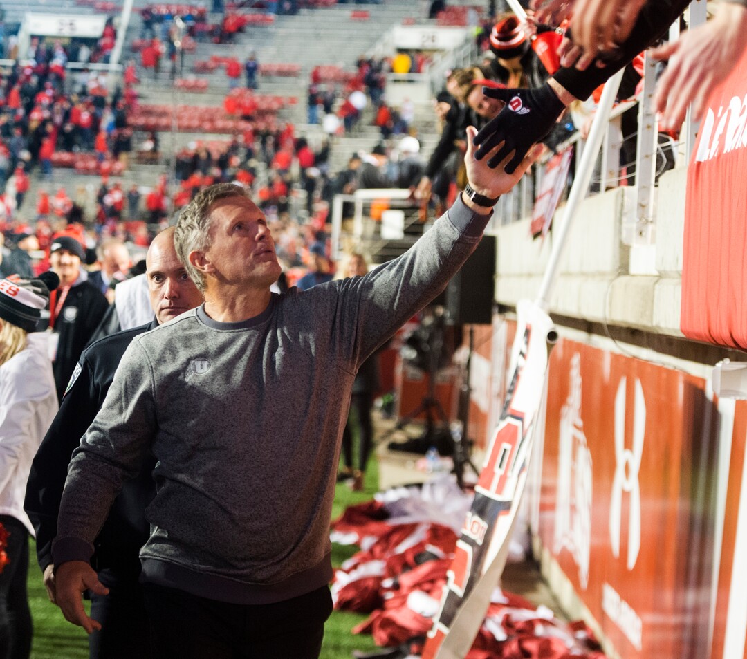 Utah head coach Kyle Whittingham high fives fans after the Utes win over theColorado Buffaloes, in PAC-12 football action Utah Utes vs. Colorado Buffaloes at Rice-Eccles stadium, Saturday, November 25, 2017.