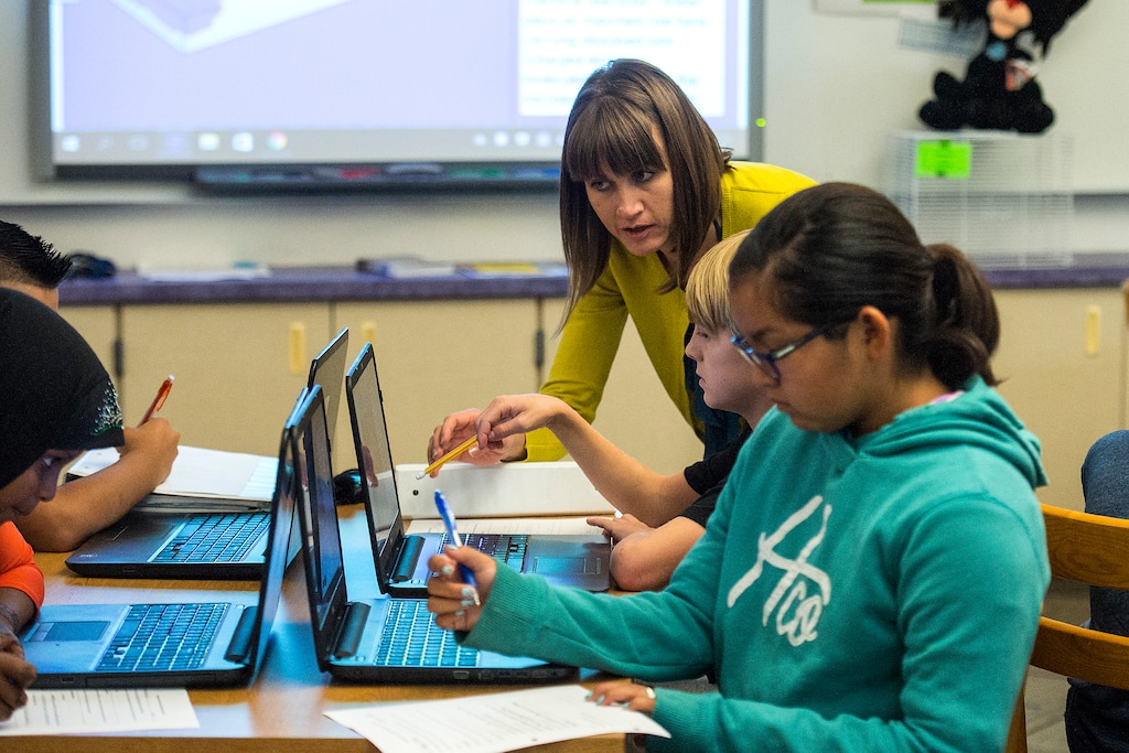 (Chris Detrick | The Salt Lake Tribune) Kim Dean works with students in her seventh grade science class at Nibley Park School in 2017. Due to declining enrollment, Nibley Park would have been one of the schools hit hardest — losing the equivalent of 4.5 full-time teachers — if Salt Lake City School District had followed its staffing formula. Instead, the board voted to suspend the formula. District staff have proposed cutting two positions at Nibley, but that number is not final.