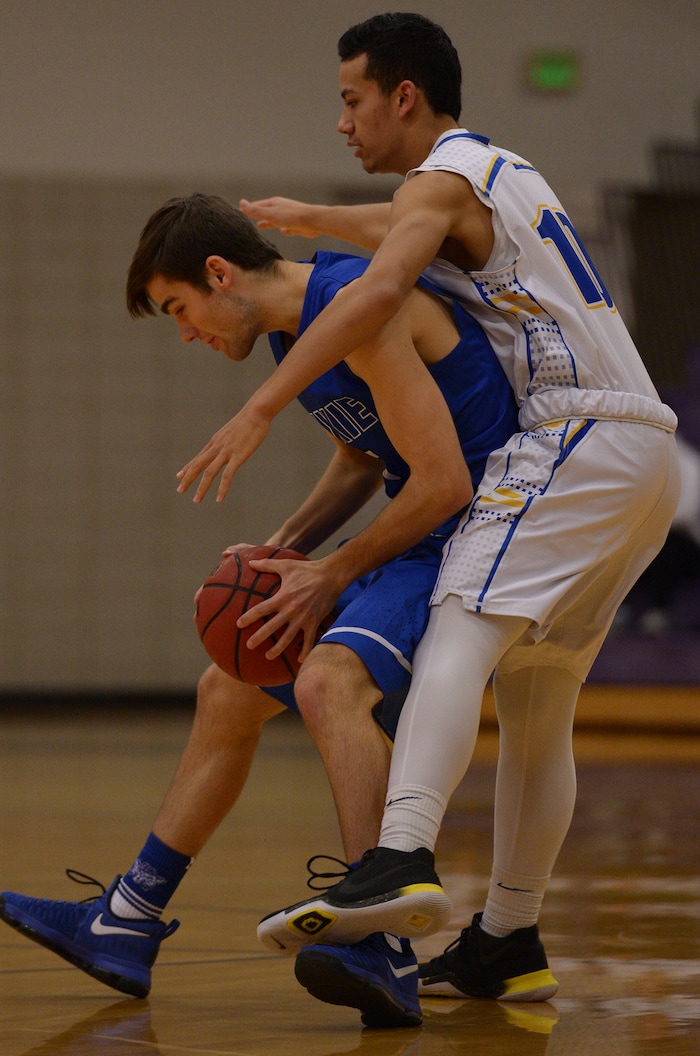 (Leah Hogsten  |  The Salt Lake Tribune) Dixie High School defeated Cyprus High School boys' basketball team 59-52 during the Riverton Holiday Tournament in Riverton, December 28, 2017. 
