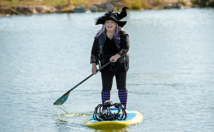 (Francisco Kjolseth  |  The Salt Lake Tribune) Kim Tracy shows off her Halloween spirit on the water as she paddle boards at Bountiful Pond on Oct. 31, 2020.