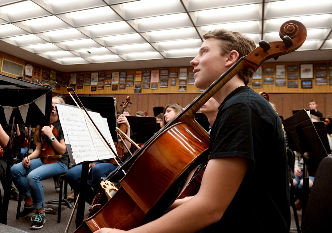 Leah Hogsten  |  The Salt Lake Tribune   "He wasn't as mean as I think he can be," said cellist Jacob Pehrson regarding Thursday's practice session with Utah Symphony Music Director Thierry Fischer. "He's understanding, is what I am trying to say." Fischer is helping members of the Cottonwood High School symphony bring to life Stravinsky's "The Firebirdâ" through the first Adopt a School pilot program. They will culminate in the performance of the piece on May 20, with Maestro Fischer conducting the live streamed event to other participating Utah orchestras who will be following along as the state's largest "Super Orchestra."