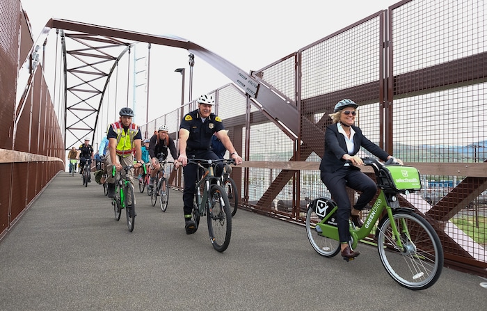 (Francisco Kjolseth | The Salt Lake Tribune) Salt Lake City Mayor Jackie Biskupski is joined by Police Chief Mike Brown, members of the public and city employees on Thursday, May 16, 2019, as part of the annual MayorÕs Bike to Work Day. This yearÕs ride began at the Northwest Recreation Center and ran primarily along the Jordan River Trail in an effort to show off the investments the city and others have made to the trail including the new 120-foot arch bridge that connects the north and south sides of the trail between 200 South and North Temple.